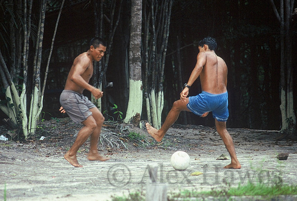 River guides playing soccer, Rio Negro, Brazil