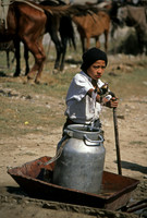 Boy pumping water in southern Kyrgyzstan